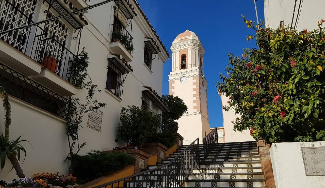 Bell tower and tiled staircase in the old town of Estepona