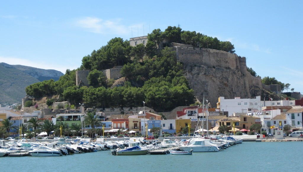 Denia Castle on a hill above the harbour with yachts