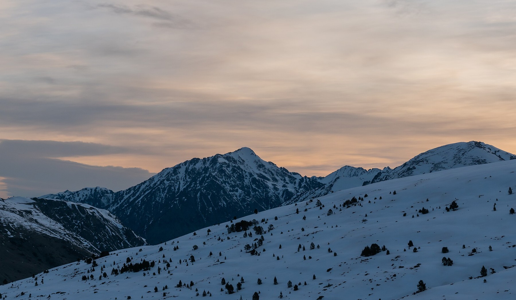 Snow covered peaks in the Andorran Pyrenees at dusk
