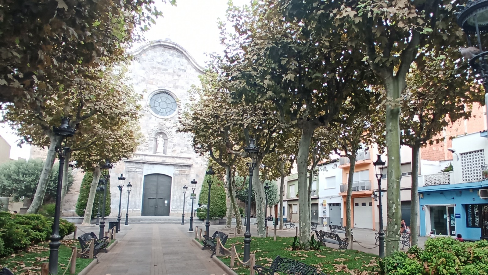 Sant Nicolau church and the plane-tree alley in central Malgrat
