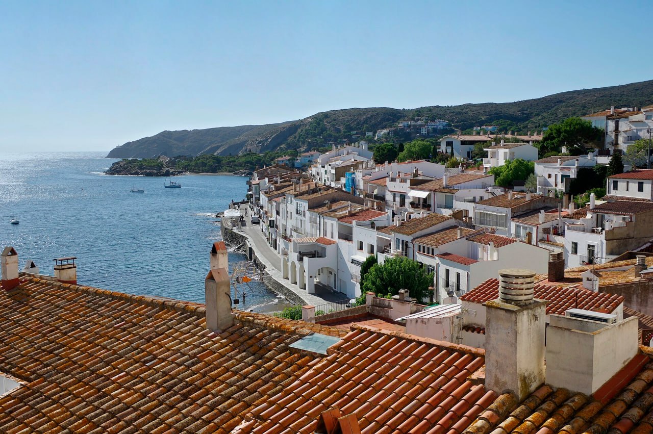 Tiled roofs of Cadaqués and the shore