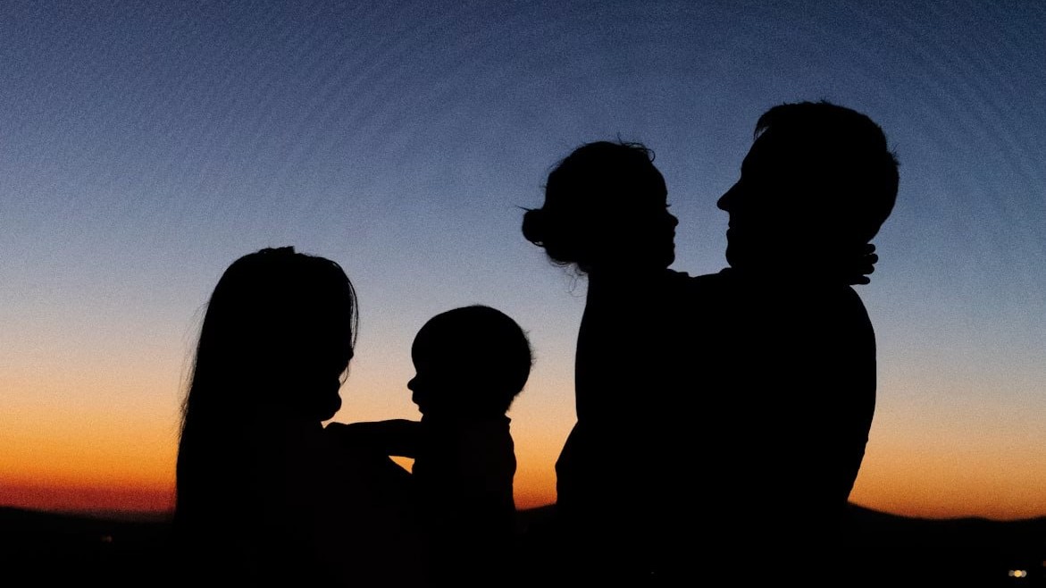 A family together at the end of a travel day