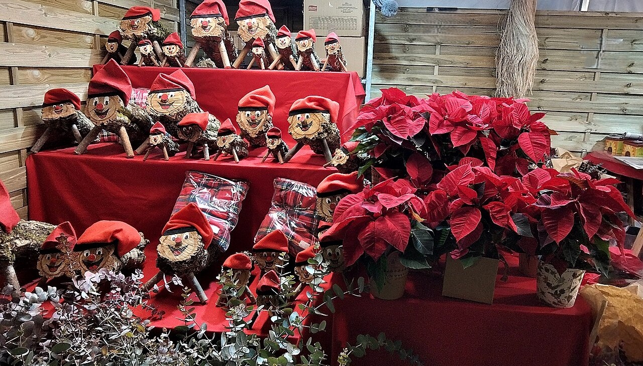 Tiós in red caps at a Christmas market in Terrassa